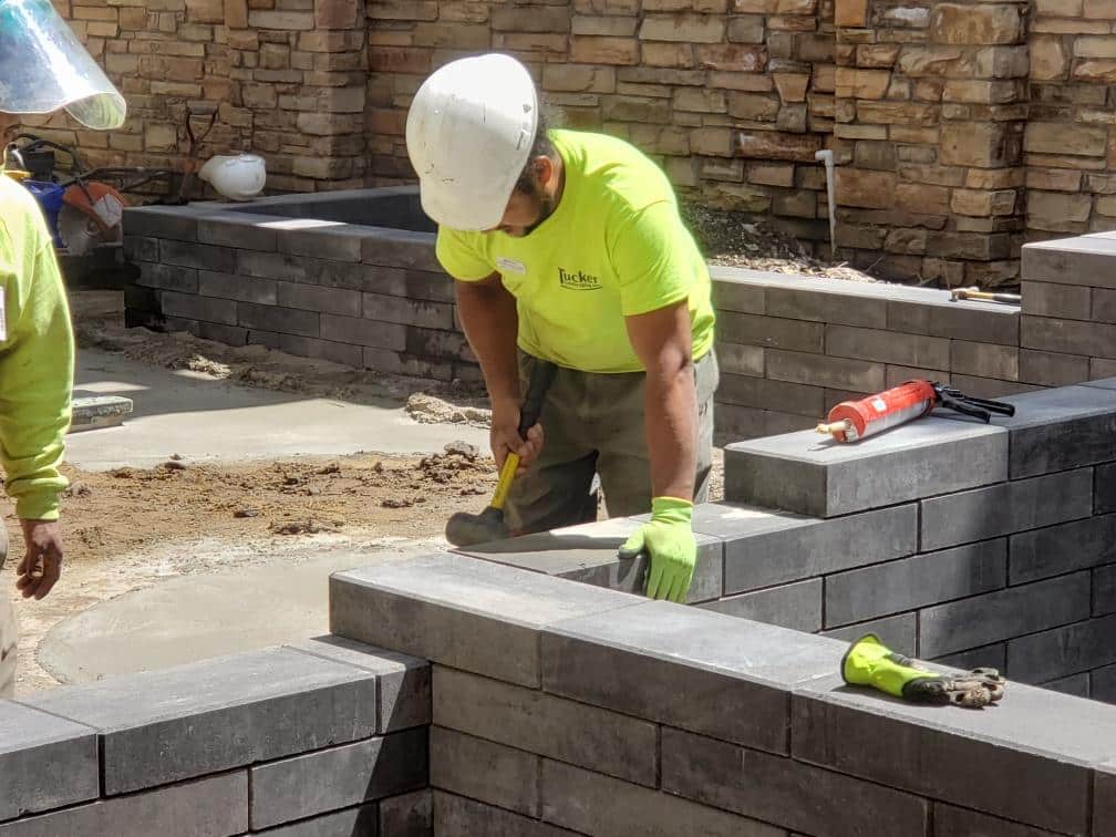 Employee working on construction landscaping